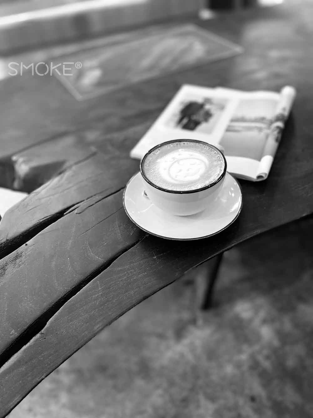 Smoke charred coffee table with latte